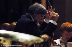 Phillip Chapman conducting the Isle of Wight Youth Orchestra at Newport Minster in a bill with Courtney Pine